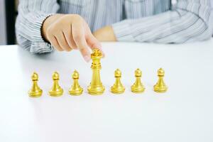 Human resources concept career management with clasped hands planning strategy with chess figures. photo