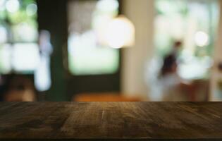 Empty wood table top and blur of out door garden background Empty wooden table space for text marketing promotion. blank wood table copy space for background photo