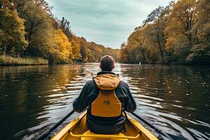 Young man kayaking on a lake in autumn. View from behind. A persons rear view of enjoying an eco friendly activity of kayaking, AI Generated photo