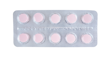 Pink tablets in blister isolated on transparent png background. Stock photo