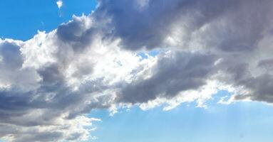 Blue sky background with white clouds. Beauty bright air background. Gloomy vivid cyan landscape. photo