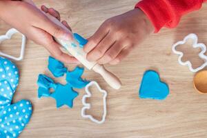 Children's hands and simulation cooking toys in the kitchen counter photo