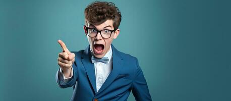 High school student in suit and glasses shocked and pointing at camera photo