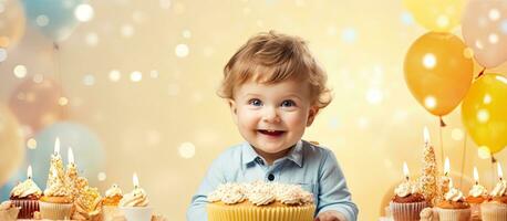 Happy 1 year old boy holding a birthday cake celebrating first birthday photo