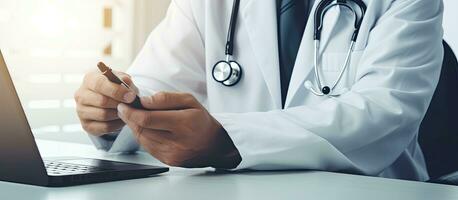 A doctor using a smartphone for online consultations writing medical records and prescriptions representing telemedicine and healthcare concept photo