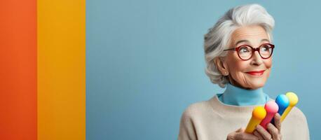 Elderly woman with gray hair holds a vertical device featuring a mockup evoking a nostalgic modern vibe on a vibrant background with room for text photo