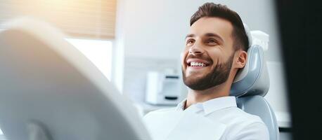 Young man receiving dental care with copy space for background photo