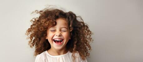 Studio portrait of a cheerful girl laughing at the camera on a white background photo