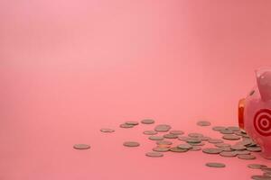 Pink piggy bank on pastel pink background, Financial concepts. photo