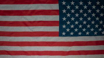 Abstract american flag on concrete cement wall, USA flag background with copy space. Top view photo