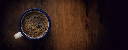 Cup of coffee on wooden background. Copy space. Top view. Flat lay. Panorama photo