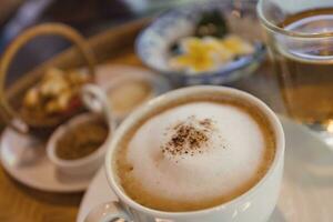 Cappuccino coffee served in a Thai style coffee shop photo