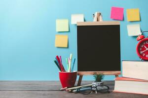 Kids desk creative workspace with school supplies, notebooks. Back to school concept. watercolor pencil need to bring for art class when you back to school. photo