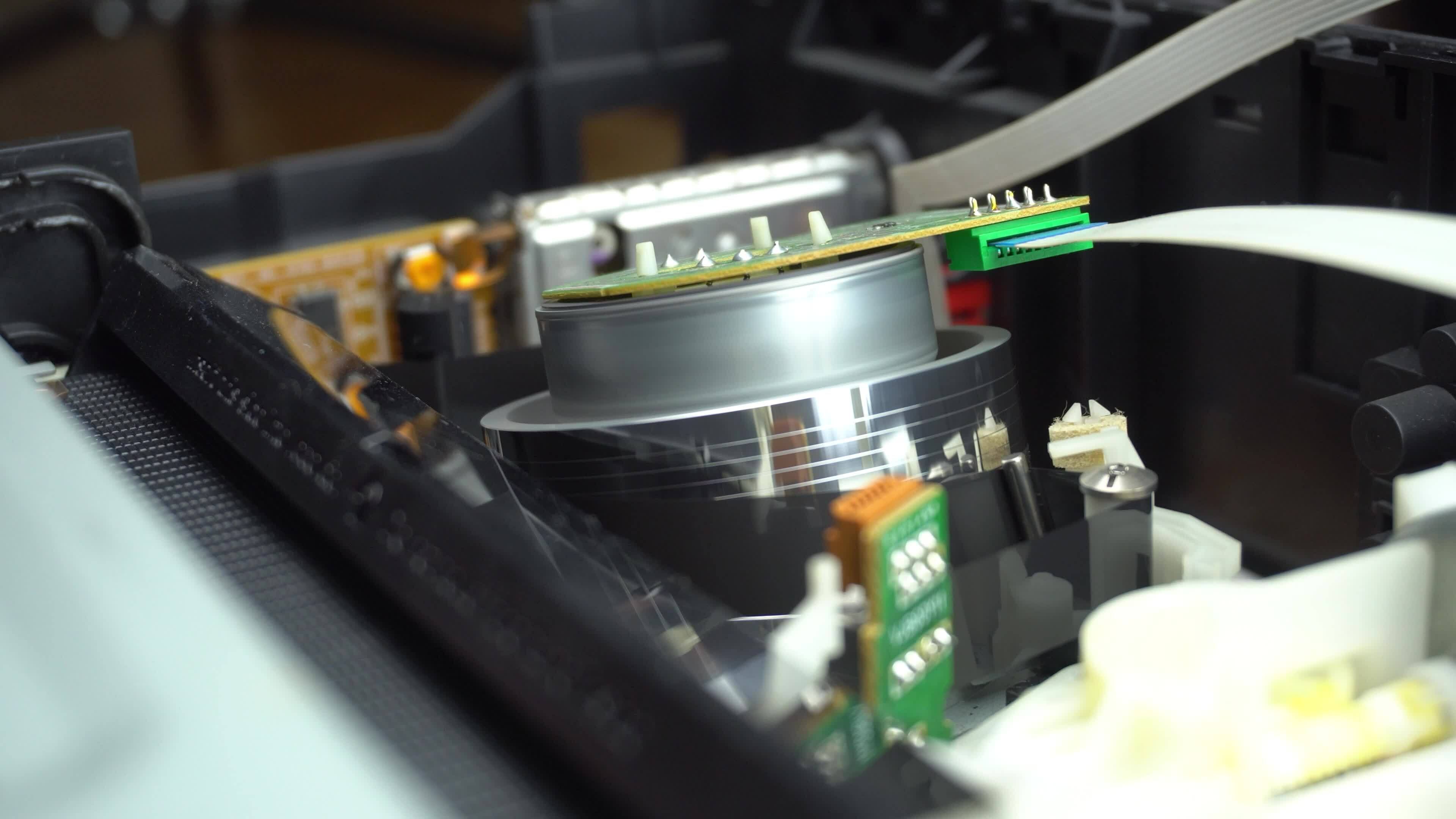 Close up of VHS play head side view with cassette tape inserting and