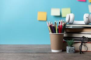 Kids desk creative workspace with school supplies, notebooks. Back to school concept. watercolor pencil need to bring for art class when you back to school. photo