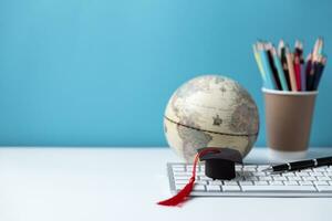 Graduation cap with Earth globe. Concept of global business study, abroad educational, Back to School, Study abroad business in universities. Elements of this image furnished by NASA. photo