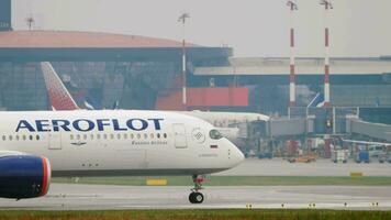 MOSCOW, RUSSIAN FEDERATION JULY 29, 2021 - Passenger Airbus A350, VQ BFZ of Aeroflot rides at Sheremetyevo airport SVO. Airplane taxiing on the taxiway video