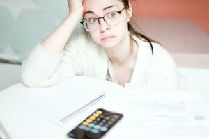 The woman was upset because of the bills. Big debts photo