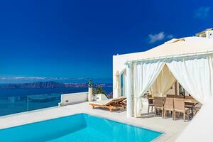 Perfect view in Santorini with white architecture luxury infinity pool over cruise ships and blue sea. Luxury summer vacation and holiday concept. Amazing landscape caldera view, travel destination photo