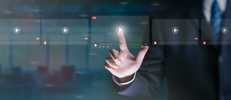 Online business, live video streaming concept. Businessman making video of business 4.0. Man using hand for online stream on virtual screen, watching on internet, live, show, podcast, online content. photo