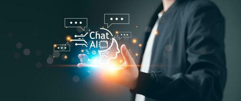 Chatbot Chat AI concept, Artificial Intelligence. Businessman using technology smart AI robot, enter command prompt, analyze data for business, Automate chatbot, Futuristic technology transformation. photo