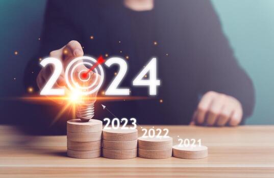 2024 Business Planning, Strategy, creative, idea concept. Businessman pointing chart graph with 2024 light bulb, growth, setting goal objective, target, goal, new year's resolution, business marketing photo