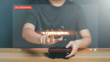 Gamer controlling joystick for Video Game With Live Chat And Donate. Streamer or creator broadcast play game, New technology trends, entertainment on virtual screen, Streaming content internet concept photo