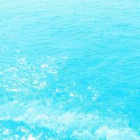 abstract blue swimming pool water background and sun light photo