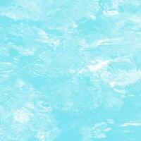 abstract blue swimming pool water background and sun light photo