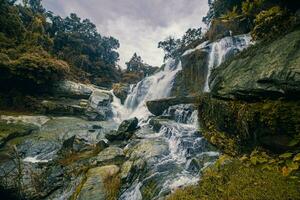 A gorgeous waterfall captured in long exposure, Chaingmai, Thailand. photo