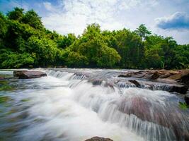 A gorgeous waterfall captured in long exposure, Thailand. photo