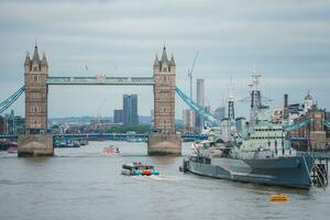 Tower Bridge in London, the UK. Sunset with beautiful clouds. photo