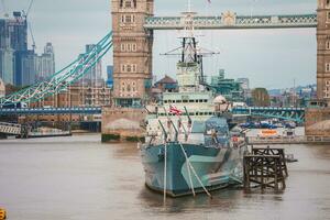 Tower Bridge in London, the UK. Sunset with beautiful clouds. photo