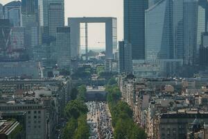 Sunny Urban Street with Green-Toned Skyscrapers photo