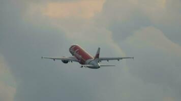 PHUKET, THAILAND NOVEMBER 26, 2016 - Passenger plane of AirAsia climb after takeoff at Phuket airport, back view long shot. Airliner flies away. Tourism and travel concept video