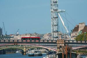 London Eye over Thames River in London. photo