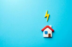 The house is connected to the electrical network. Utilities supplies services. Household powered by an energy source. Efficient use of electricity to reduce costs. Thunderstorm alert photo