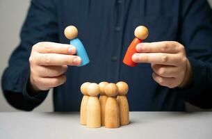 Choose which leader to put at the head of the team. Considering candidates for leadership positions. Evaluate skills, experience, and ability to inspire and motivate the team. photo