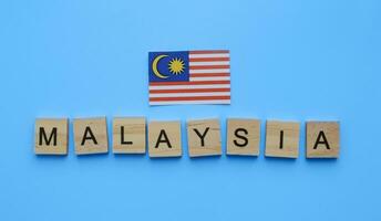 August 31, Malaysia Independence Day, Malaysia National Day, flag of Malaysia, minimalistic banner with the inscription in wooden letters photo