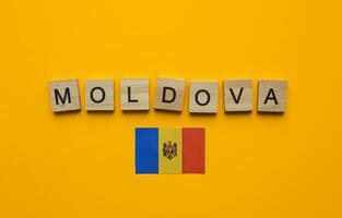 August 27, Moldova Independence Day, flag of Moldova, minimalistic banner with the inscription in wooden letters photo