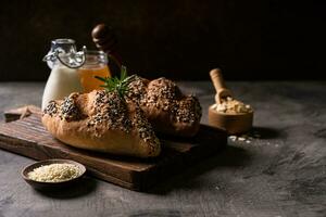 Fresh homemade bread whole wheat baguette on napkin and abstract table. Sourdough bread photo