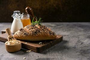 Fresh homemade bread whole wheat baguette on napkin and abstract table. Sourdough bread photo