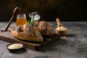 Fresh homemade bread whole wheat baguette on napkin and abstract table. Sourdough bread photo