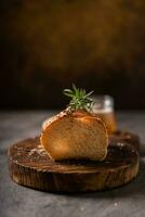 Artisan bread whole wheat baguette white milk and honey on rustic wooden board and abstract table. Sourdough bread photo