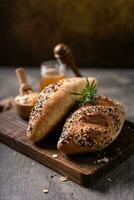 Fresh homemade bread whole wheat baguette on napkin and abstract table. Sourdough bread photo