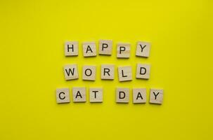 August 8, World Cat Day, minimalistic banner, inscription in wooden letters Happy World Cat Day photo