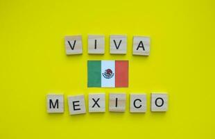 September 16, Independence Day of Mexico, Viva Mexico, flag of Mexico, minimalistic banner with the inscription in wooden letters photo