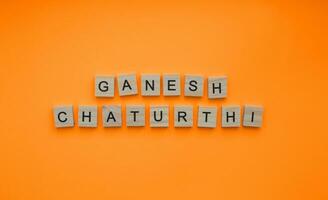 On September 19, Ganesh Chaturthi, a minimalistic banner with an inscription in wooden letters photo