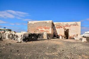 an old building with fading paint photo