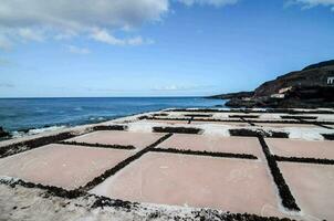 salt pans on the beach in the canary islands photo